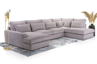 Duży szary narożnik sztruksowy w kształcie litery U z miękkimi poduchami