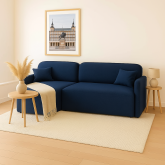 Mała granatowa kanapa rogowa z funkcją spania codziennego
