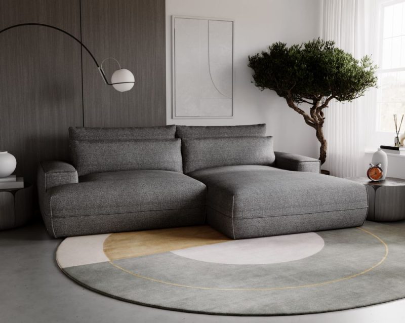 Szary, mały narożnik z funkcją spania