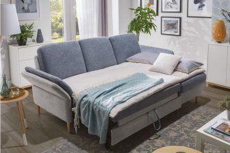 Mały narożnik do salonu z funkcją spania i pojemnikiem na pościel