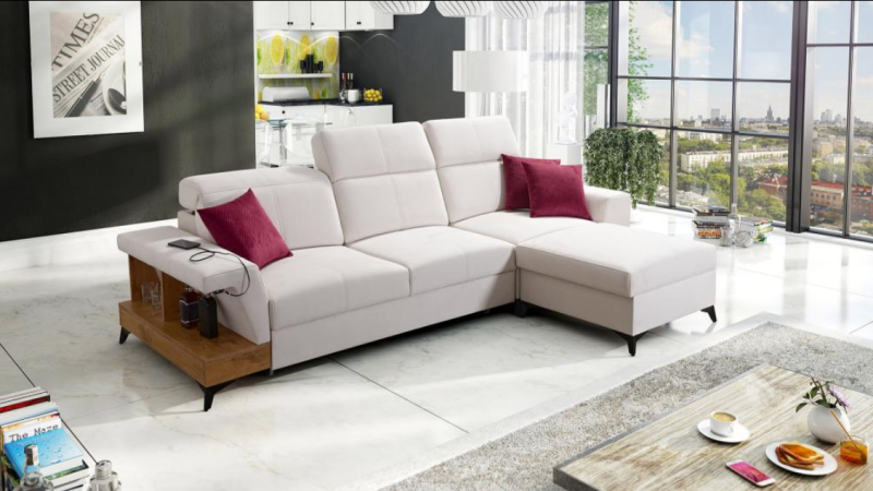 Nieduży narożnik do salonu z funkcją spania i pólką