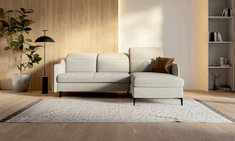 Kanapa narożna z funkcją spania na wysokich nóżkach do kawalerki