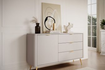 Piękna beżowa komoda z obłymi bokami na złotych nogach