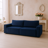 Granatowa sofa z dużą powierzchnią spania i z dwoma pojemnikami na pościel