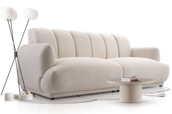 Beżowa obła sofa z oparciem bez poduszek