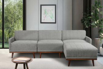 Narożnik L w stylu vintage na wysokich drewnianych nogach